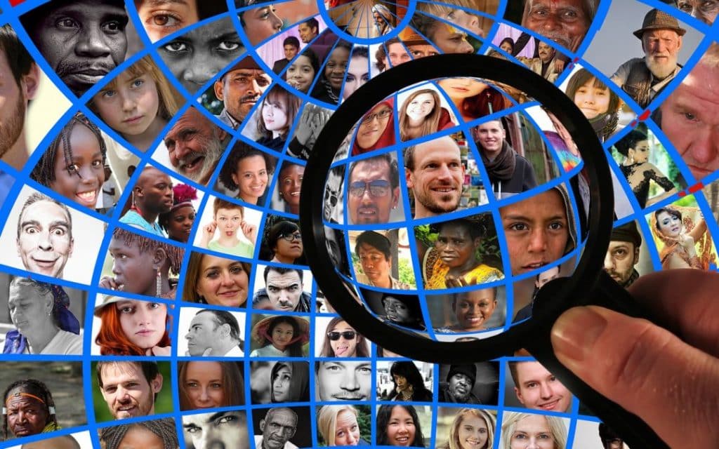 a magnifying glass over people representing data